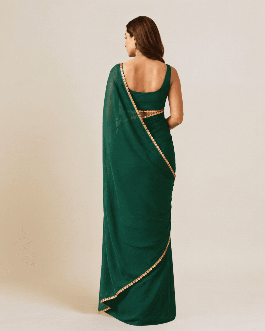Emerald-green georgette saree, back view with a low draped tie-back blouse